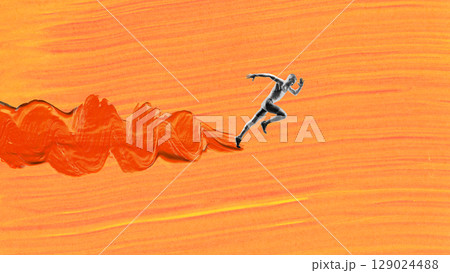 Bright collage. Black-and-white male sprinter dashing forward with explosive motion on swirling orange brushstroke Bright collage. Black-and-white male sprinter dashing forward with explosive motion on swirling orange brushstroke 129024488