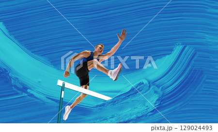 Creative artwork. Male athlete leaping over hurdle with focused expression on dynamic blue paint stroke background Creative artwork. Male athlete leaping over hurdle with focused expression on dynamic blue paint stroke background 129024493