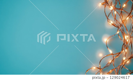 copper string lights on teal background copper string lights on teal background 129024617