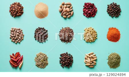 colorful spice collection on teal background 129024894