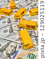 Paper us 100 dollar bill with gold bars, concept of investment and saving, wealth 129025119