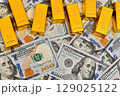 Paper us 100 dollar bill with gold bars, concept of investment and saving, wealth 129025122