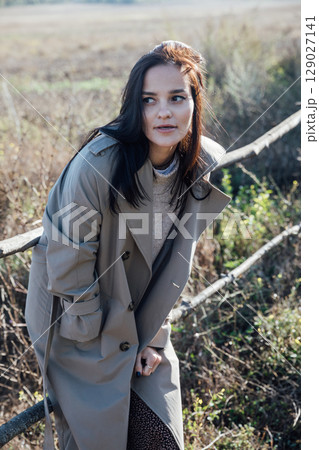 Portrait of Beautiful Woman in Autumn Clothes in Village Portrait of Beautiful Woman in Autumn Clothes in Village 129027141