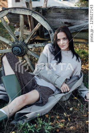 Portrait of Beautiful Woman in Autumn Clothes in Village Portrait of Beautiful Woman in Autumn Clothes in Village 129027143