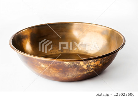 Empty gold pan is shown with gold specks, suggesting someone was recently using it 129028606