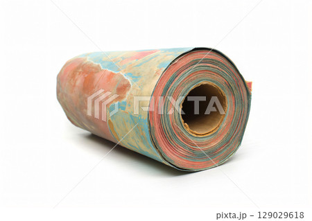 Roll of colorful moisture barrier paper is lying on a white background, creating an interesting pattern Roll of colorful moisture barrier paper is lying on a white background, creating an interesting pattern 129029618