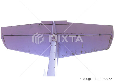 Detailed View of Aircraft Wing with Wear and Tear Showing Age and Use in Flight Operations Captured from an Upside-Down Perspective Highlighting Engineering Excellence and Design Detailed View of Aircraft Wing with Wear and Tear Showing Age and Use in Flight Operations Captured from an Upside-Down Perspective Highlighting Engineering Excellence and Design 129029972
