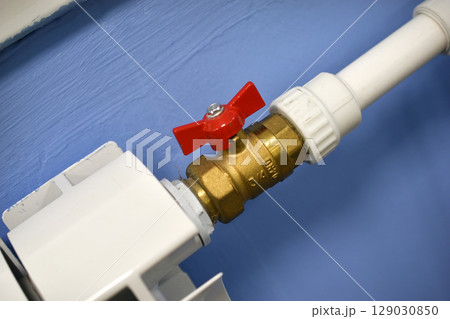 A water radiator for heating. A white radiator for indoor heating. 129030850