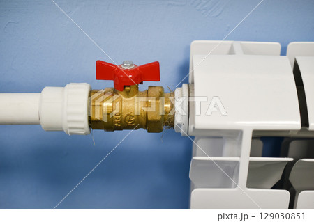 A water radiator for heating. A white radiator for indoor heating. 129030851