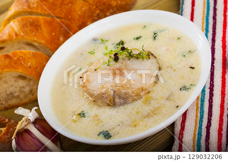 Creamy haddock soup with herbs 129032206