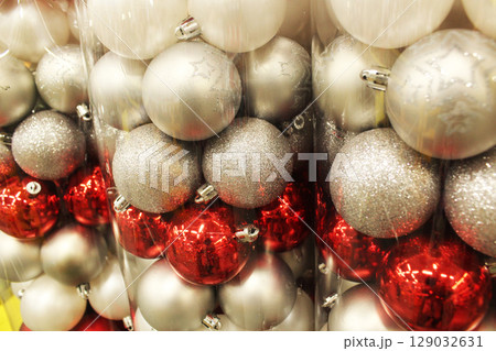 White Red Christmas Balls in Packaging Close-Up. White Red Christmas Balls in Packaging Close-Up. 129032631
