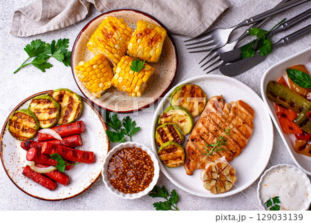 Assortment of grilled bbq meat and vegetables Assortment of grilled bbq meat and vegetables 129033139