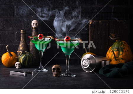 Halloween cocktails with spooky decorations scene Halloween cocktails with spooky decorations scene 129033175