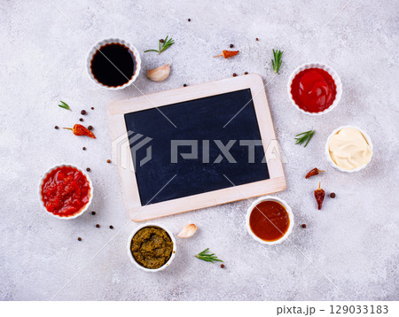 Set of different sauces. Ketchup, mustard, pesto Set of different sauces. Ketchup, mustard, pesto 129033183