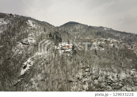 Traditional mountain remote cabins and houses in winter highlands Traditional mountain remote cabins and houses in winter highlands 129033228