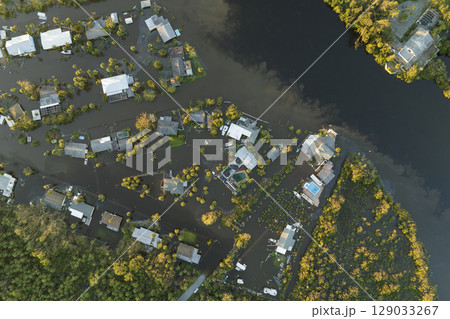 Surrounded by hurricane Ian rainfall flood waters homes in Florida residential area. Aftermath of natural disaster 129033267