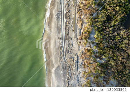 Storm surge destroyed oceanfront road on Gulf coast after hurricane in Florida. Severe damage to transportation infrastructure 129033363