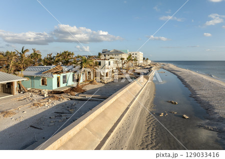 Ruined buildings in need of demolition or repair. Storm surge water and wind damaged houses roof and collapsed walls after hurricane in Florida Ruined buildings in need of demolition or repair. Storm surge water and wind damaged houses roof and collapsed walls after hurricane in Florida 129033416