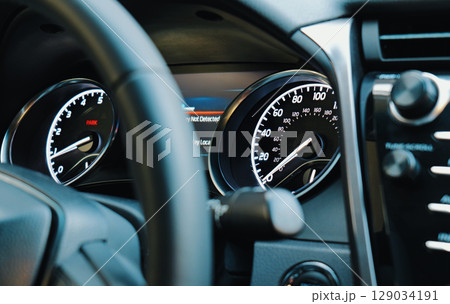 Close view of a car dashboard displaying speedometer Close view of a car dashboard displaying speedometer 129034191