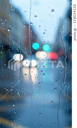 Raindrops on window with city lights blurred behind, moody rainy evening vibe. Soft emotional wallpaper. Generative AI. 129034528