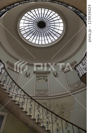 the Nelson Staircase within Somerset House in London, a grand spiral staircase inside a neoclassical building, 129036824