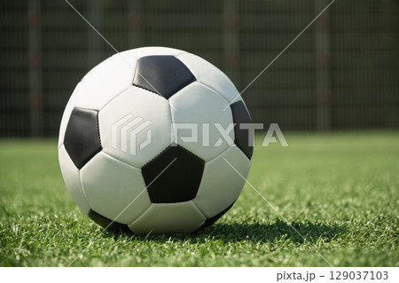 Soccer Ball on Field in Front of Goal Post Soccer Ball on Field in Front of Goal Post 129037103