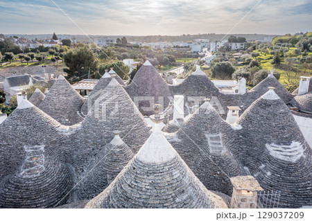 Alberobello trulli rooftops, Puglia, Italy, showcasing unique architecture and cultural heritage.. 129037209