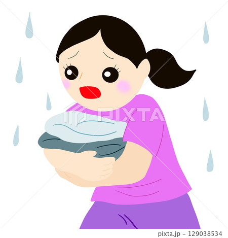 突然の雨で洗濯物を抱えて走る 129038534