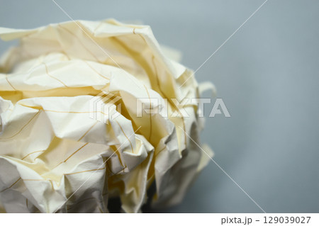 round lump paper on grey background, recycle used paper round lump paper on grey background, recycle used paper 129039027