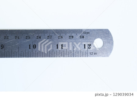 metal ruler isolated on white background, object for education 129039034