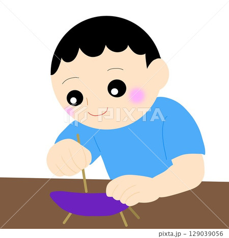 精霊馬を子どもが一生懸命に作っている 129039056