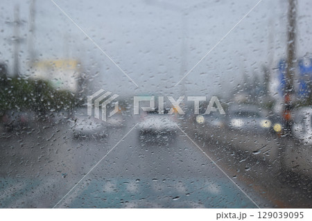 car on highway road with rainny season, blurred image 129039095