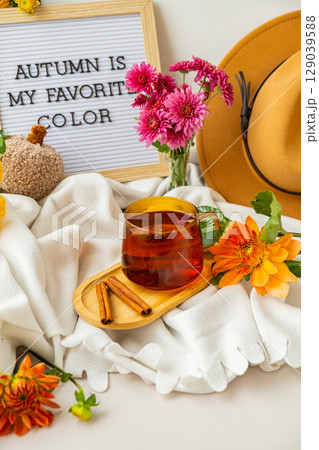 Letter board with text AUTUMN IS MY FAVORITE COLOR Fall Bouquet for Thanksgiving holiday. Seasonal Warm colorful blossom flowers arrangement festive decoration. Selective 129039588