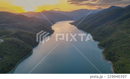 Zhinvali Reservoir in Georgia, scenic lake surrounded by green mountains and forests Zhinvali Reservoir in Georgia, scenic lake surrounded by green mountains and forests 129040397