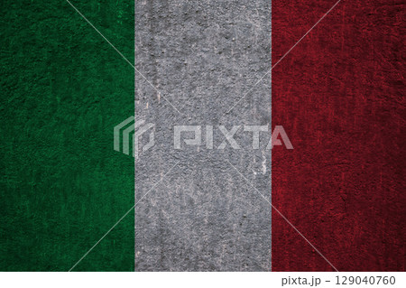 Flag of Italy on a textured relief wall. Patriotic design 129040760