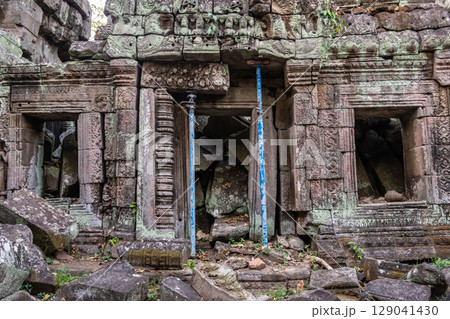 Ta Prohm temple, one of Angkor's best visited monuments. It is known for the huge trees and massive roots growing out of its walls in Siem Reap, Cambodia. Ta Prohm temple, one of Angkor's best visited monuments. It is known for the huge trees and massive roots growing out of its walls in Siem Reap, Cambodia. 129041430