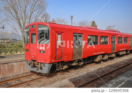 March 25 2025 Red Passenger Train at Modern Railway Station Platform, Japan 129045306