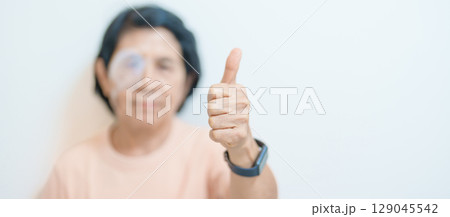 Elderly Woman with eye protective shield after eye surgery. Eye disease, Cataract,  Glaucoma, Age Related Macular Degeneration, Diabetic Retinopathy, Vitreous, Lasik, World Glaucoma day and health 129045542
