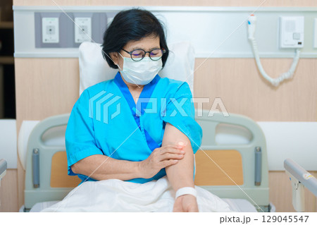 Elderly asian Patient Woman with medical patch plaster after blood test in hospital. Diagnose, illness, treatment, Insurance, Healthcare, medical Examination, Blood donation and World Blood Donor Day 129045547