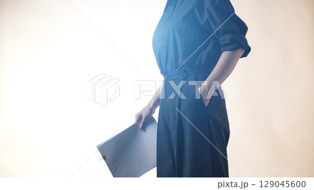 Business concept. A confident gesture by a female leader with leadership and innovative attitude. Business concept. A confident gesture by a female leader with leadership and innovative attitude. 129045600