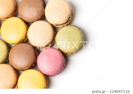Small colorful tasty sweet original classic macaroons cakes isolated on white studio background Small colorful tasty sweet original classic macaroons cakes isolated on white studio background 129047116