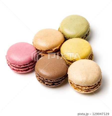 Small colorful tasty sweet original classic macaroons cakes isolated on white studio background 129047129