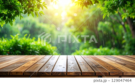 Empty wooden table with a nature background of green grass, trees, and a sunny blue sky Empty wooden table with a nature background of green grass, trees, and a sunny blue sky 129047464