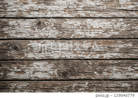 Rustic background of old wooden planks with distressed white paint. Vintage grunge wood texture for design and artistic projects Rustic background of old wooden planks with distressed white paint. Vintage grunge wood texture for design and artistic projects 129048779