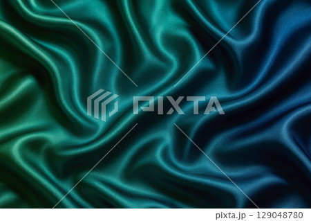 Luxury silk fabric texture background with blue and green gradient. Elegant smooth satin textile with folds for abstract design 129048780