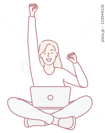 A Joyful Woman Celebrating Her Significant Achievement While She Works on Her Laptop 129049326