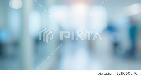 Abstract blur of hospital corridor or clinic interior, bright medical background with light flare for healthcare and science concepts Abstract blur of hospital corridor or clinic interior, bright medical background with light flare for healthcare and science concepts 129050340