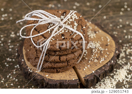 biscuits on the kitchen table, chocolate biscuits with real cocoa and sesame biscuits on the kitchen table, chocolate biscuits with real cocoa and sesame 129051743