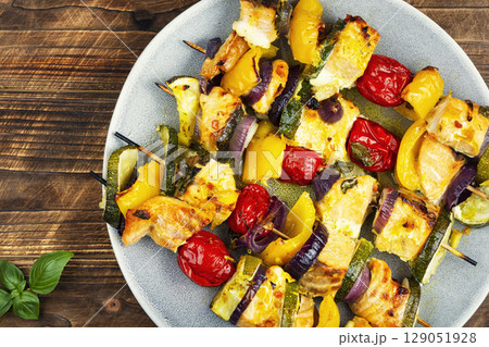 Fish shashlik with vegetables on rustic wooden table. Fish shashlik with vegetables on rustic wooden table. 129051928
