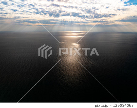 Aerial view sunset sky Beautiful light sunset or sunrise over sea Colorful scenery sunset sky waves texture background 129054068